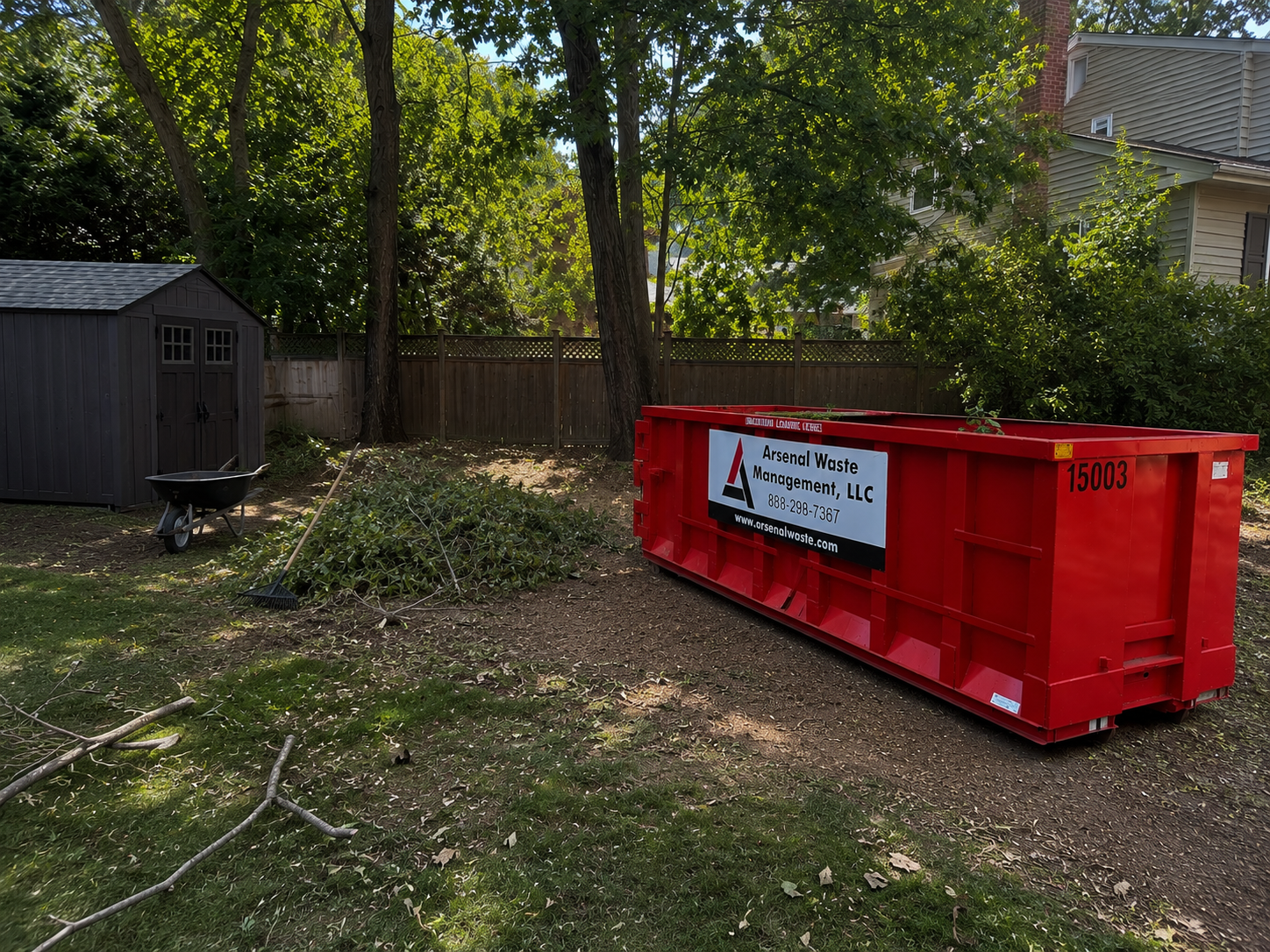Arsenal Waste Management red roll-off truck servicing Rockingham County New Hampshire