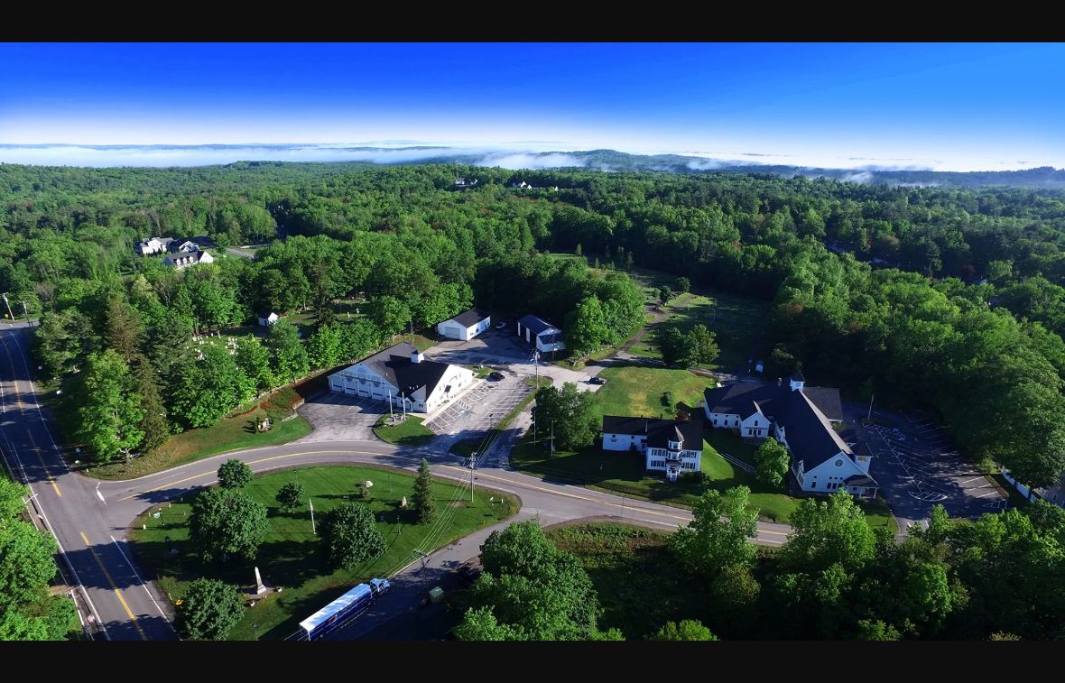 Aerial view of Atkinson town center, its common and surrounding woodland in New Hampshire