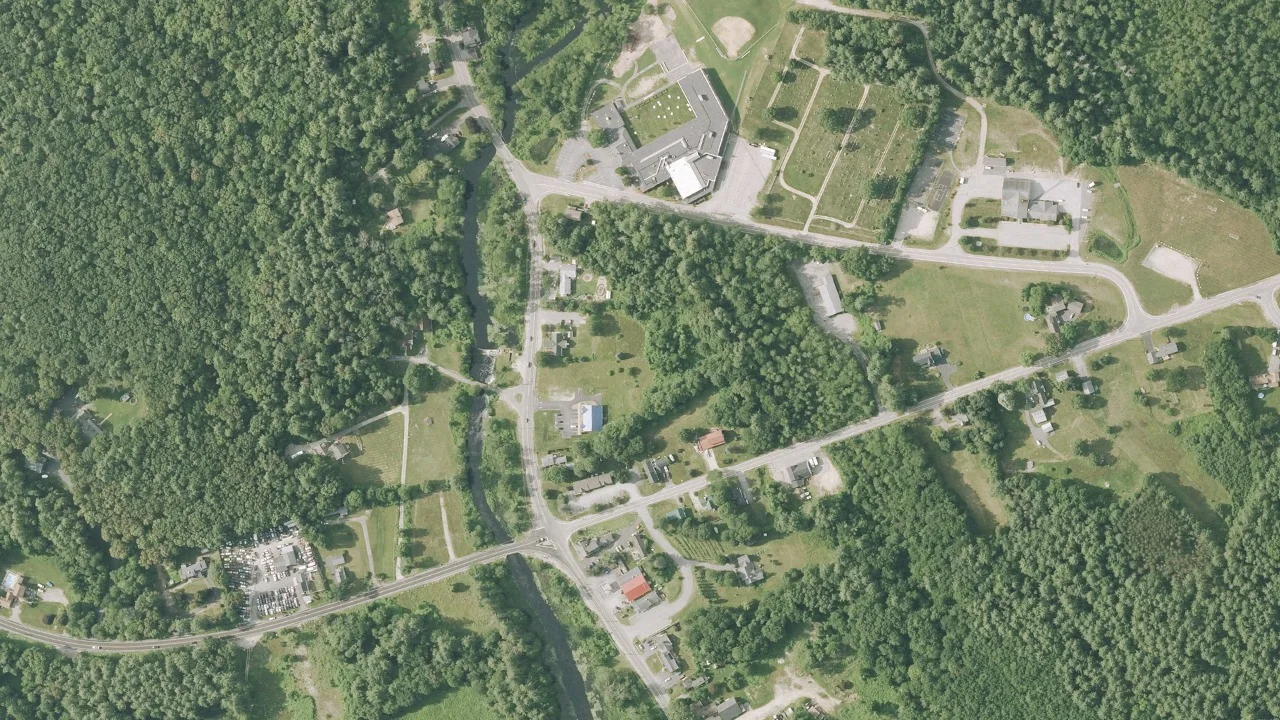 Aerial view of Auburn village and its wooded surroundings near Hooksett Road, New Hampshire