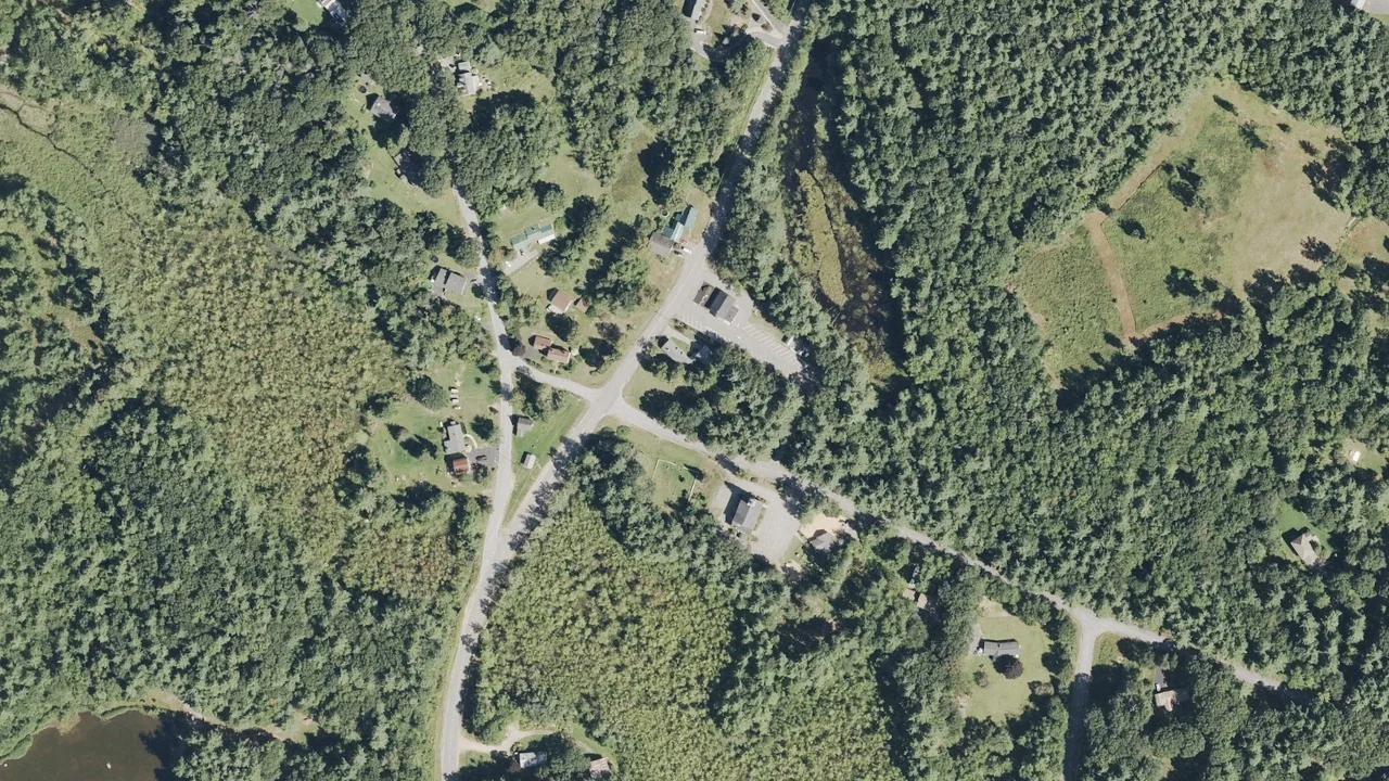 Aerial view of historic Bow Center and nearby wooded neighborhoods, New Hampshire
