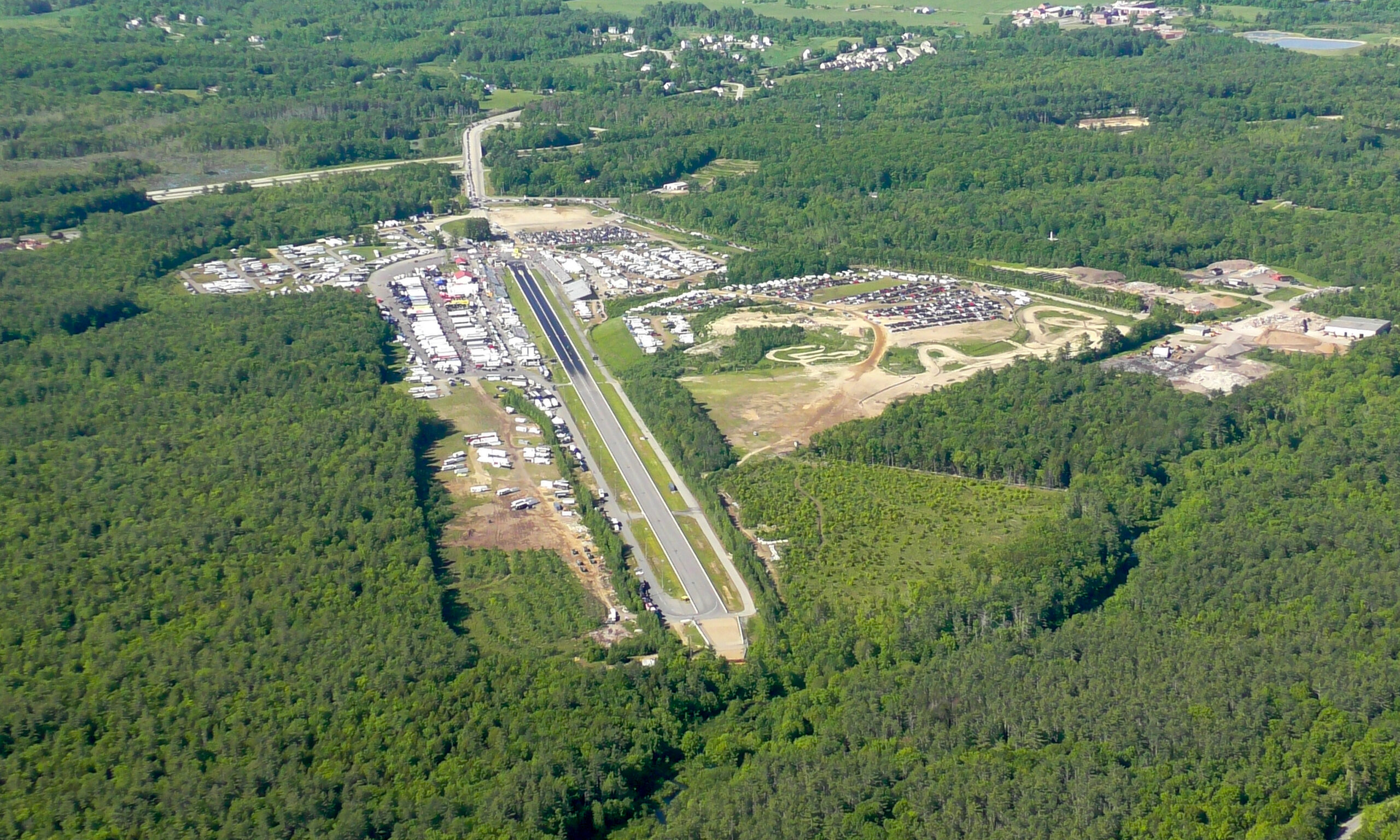Aerial view of New England Dragway and surrounding forest in Epping, New Hampshire