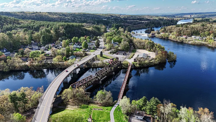 Aerial view of Hooksett village and its bridges across the Merrimack River, New Hampshire