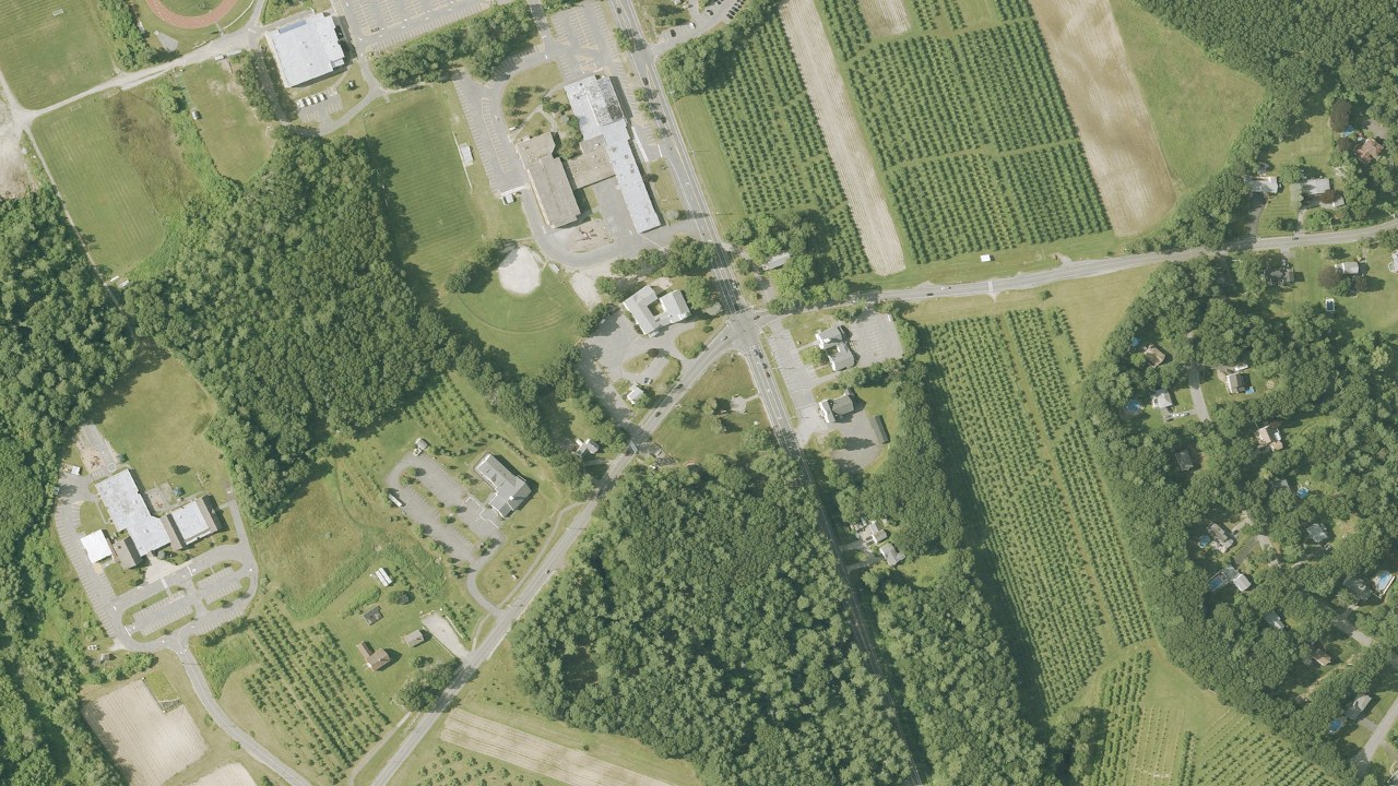 Aerial view of Londonderry Town Common, churches and nearby orchards, New Hampshire