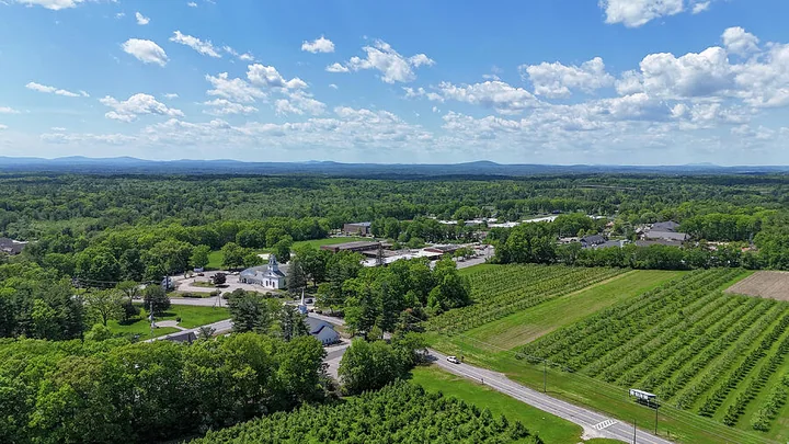 Aerial view of Londonderry village, church and orchards, New Hampshire