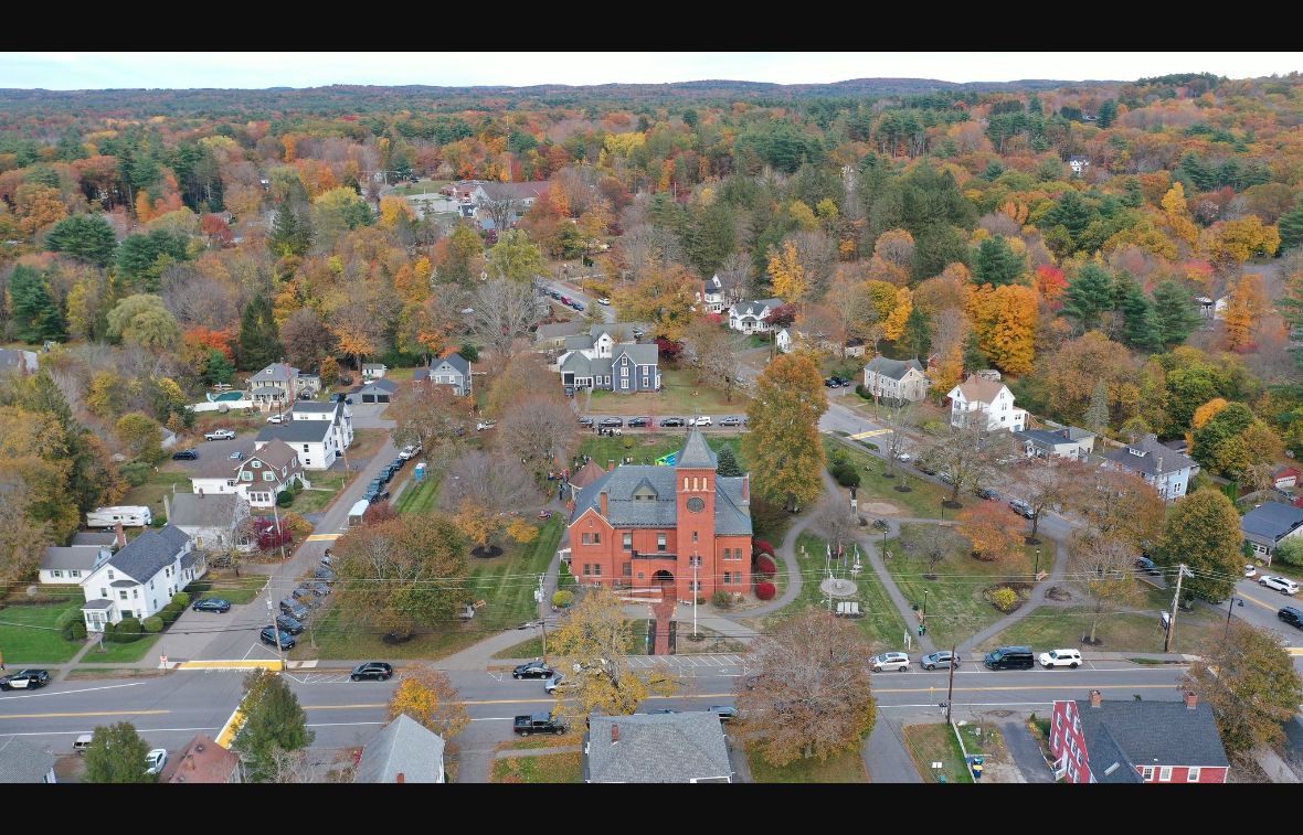 Autumn aerial view of Plaistow Town Hall and surrounding town-center streets in New Hampshire