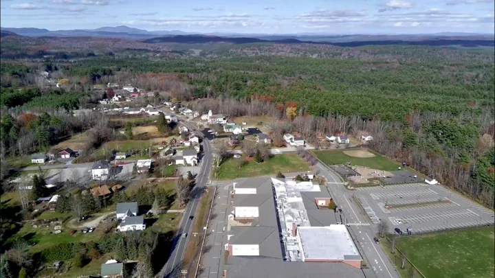 Aerial view of village buildings and surrounding woodland in Weare, New Hampshire