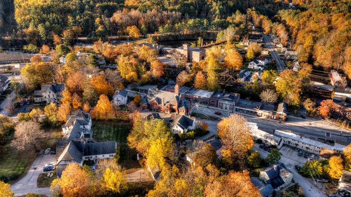 Autumn aerial view of downtown Wilton, its town hall and river corridor, New Hampshire