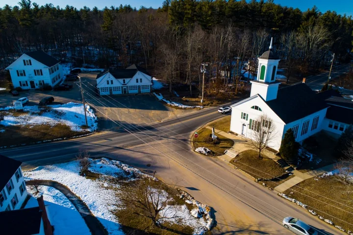 Winter aerial view of Windham village center and its historic church, New Hampshire